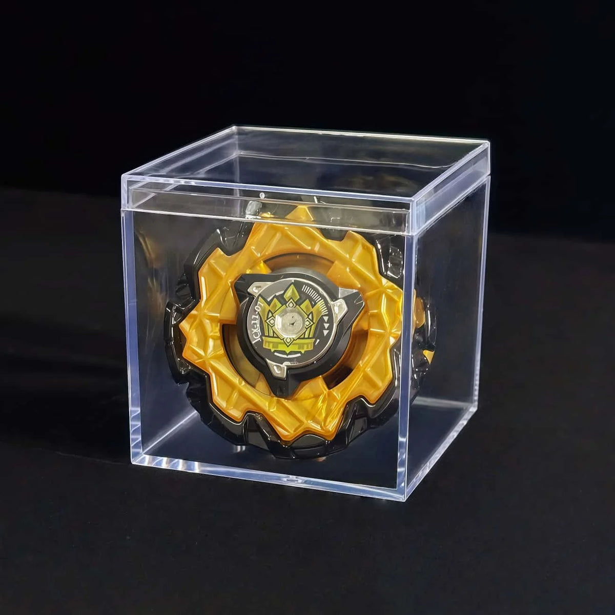 A Valkyrie Volt S4-70V metal spinning top with launcher displayed inside a clear plastic box.