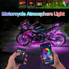 A motorcycle is illuminated with purple light, demonstrating the atmosphere light effect controlled by a smartphone and remot