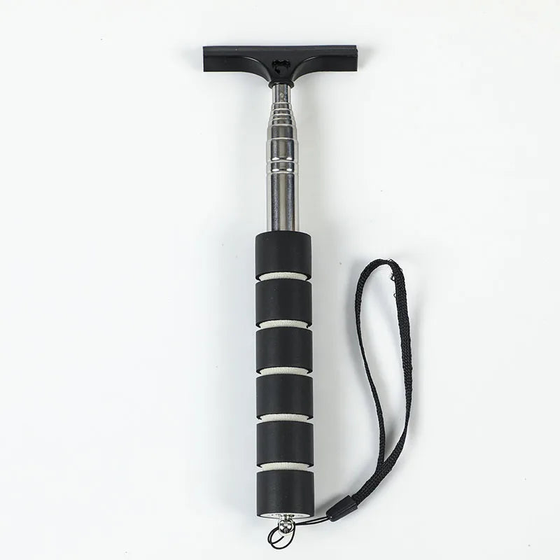A black retractable car mirror and window cleaning wiper with a silver shaft and black cord.