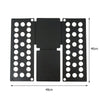 A black portable clothes folding board with multiple holes for laundry organization.
