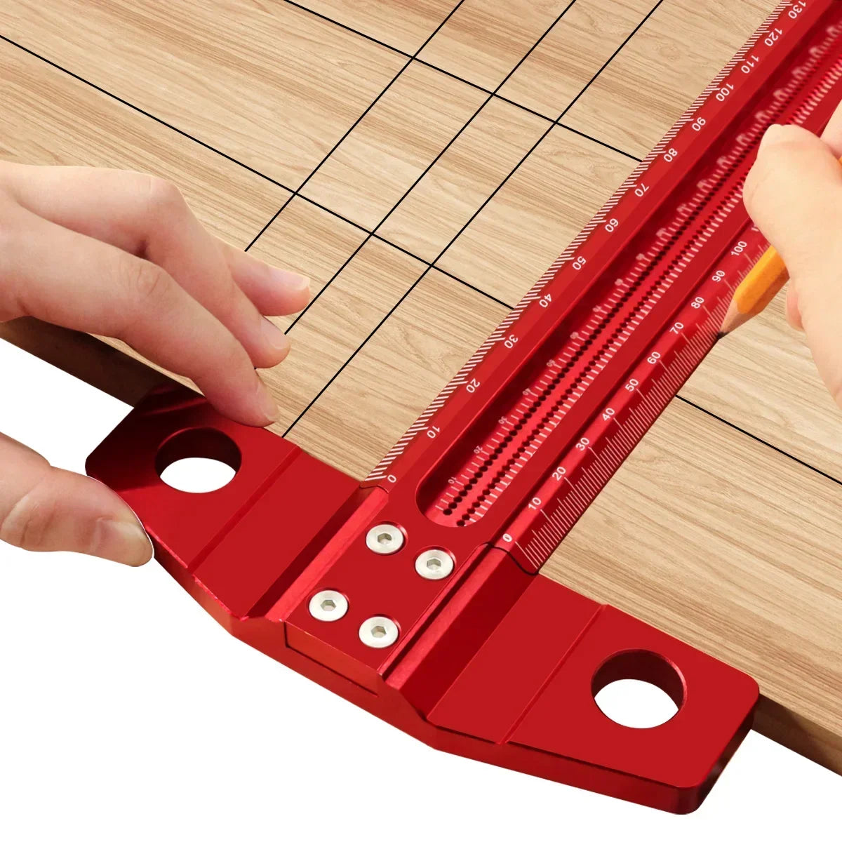 A hand is using a precision aluminum alloy T-ruler with a red scale to mark wood for woodworking.