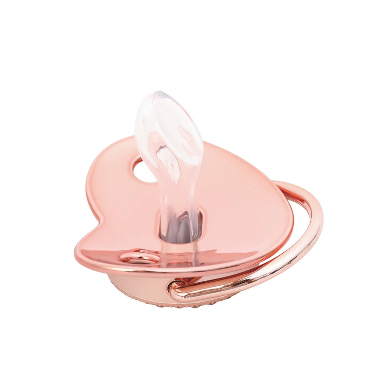 A pink crystal rhinestone pacifier chain clip set with a silicone nipple and ring.