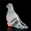 A soft gray pigeon plush toy with dark stripes, shown in a profile view against a black background.