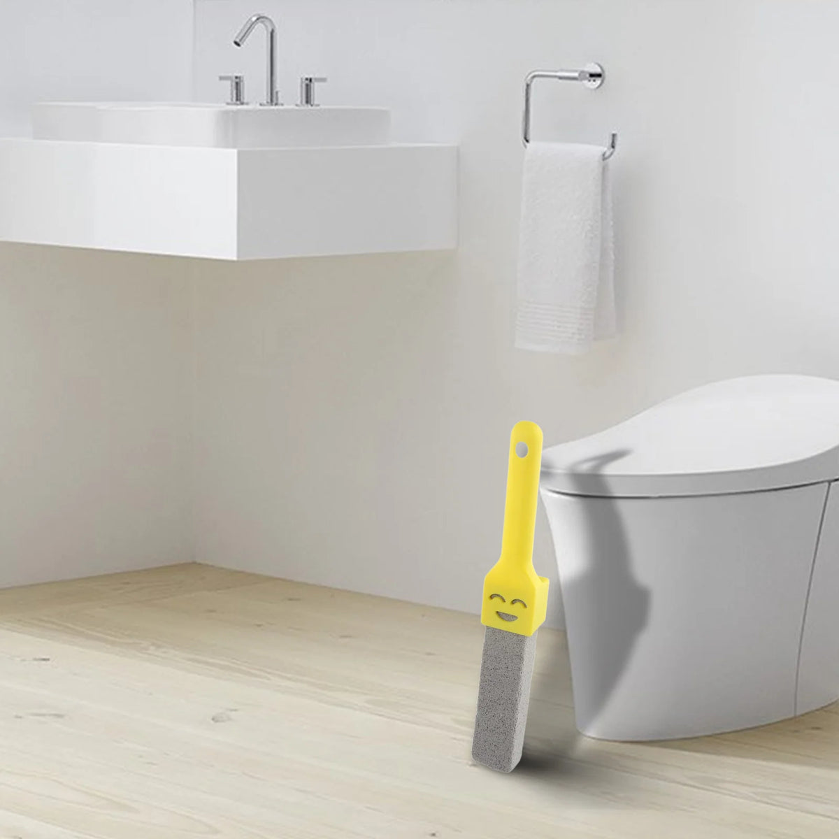A yellow pumice stone toilet and bathroom cleaning brush with a handle standing next to a white toilet.