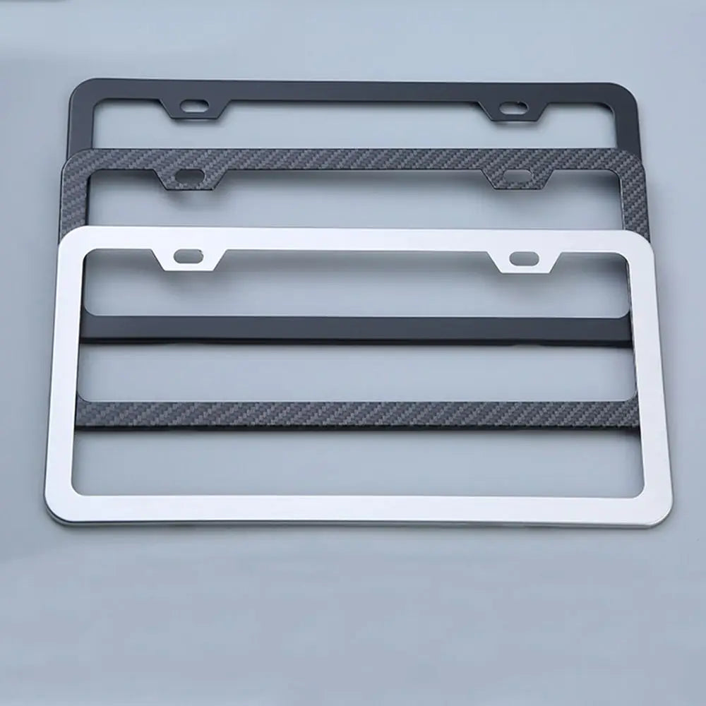 A set of two license plate frames, one black and one white, made of rustproof stainless steel.