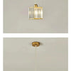 A modern crystal pendant light with an iron frame hanging from the ceiling.