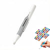 A white automatic diamond painting bead dispenser pen with a silver tip is shown being held by a hand.