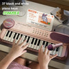 A child plays a pink electronic keyboard piano with a microphone and stand, surrounded by piano keys and sheet music.
