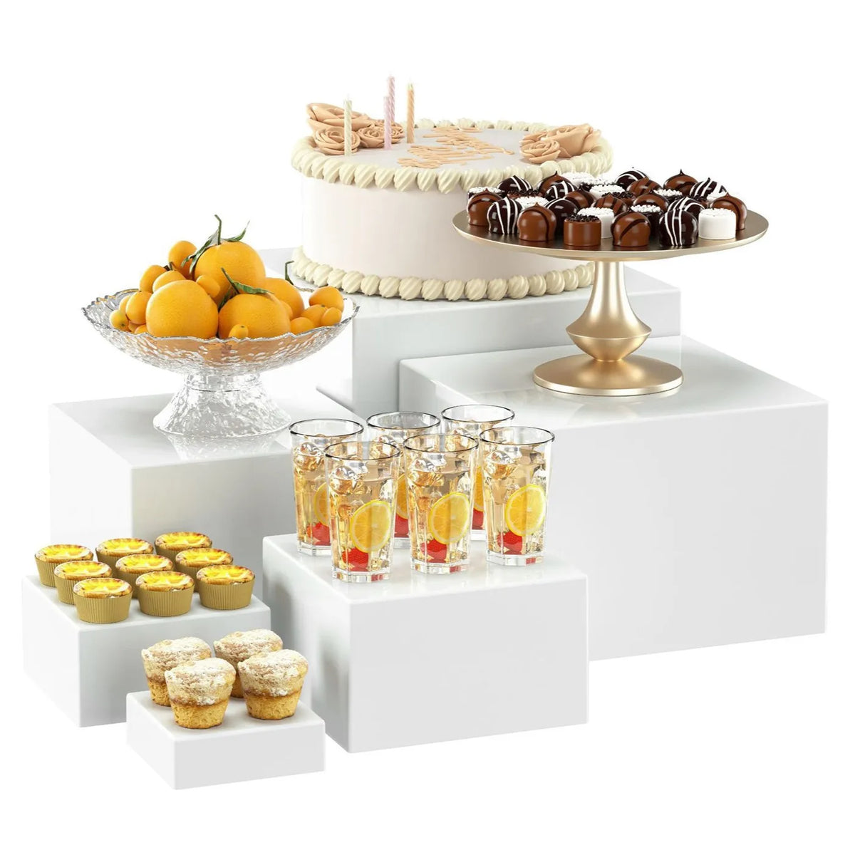 A tiered display featuring chocolate cupcakes, fruit, and small desserts on white acrylic risers.