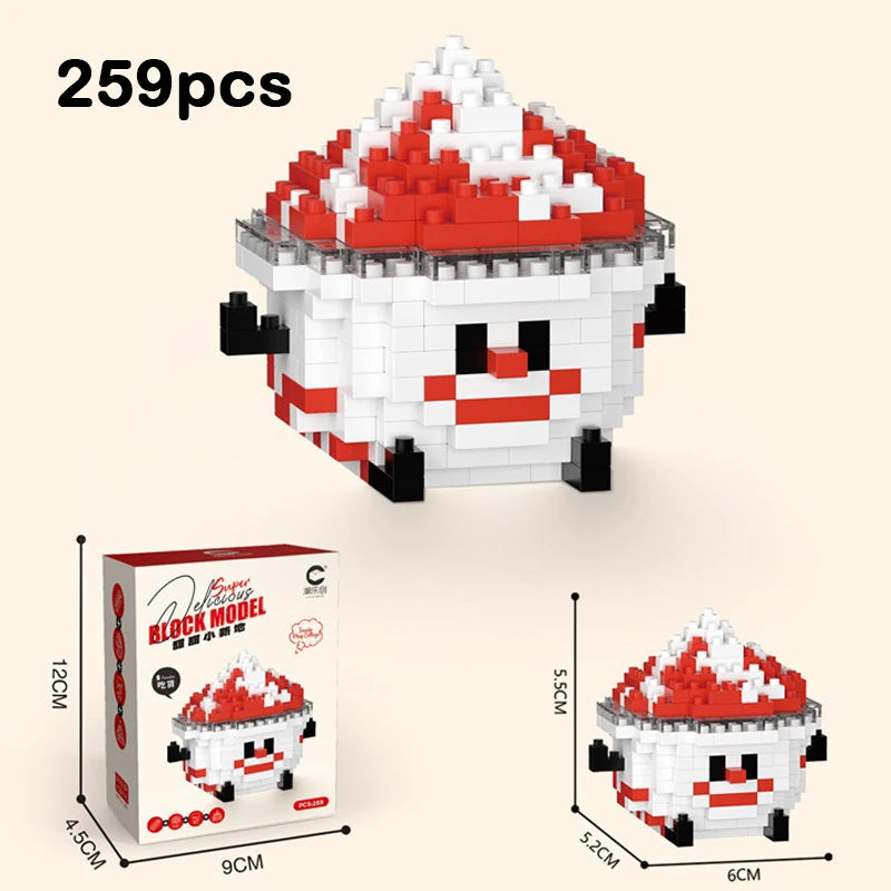 A white and red building block figurine shaped like a dessert, shown next to its packaging box.