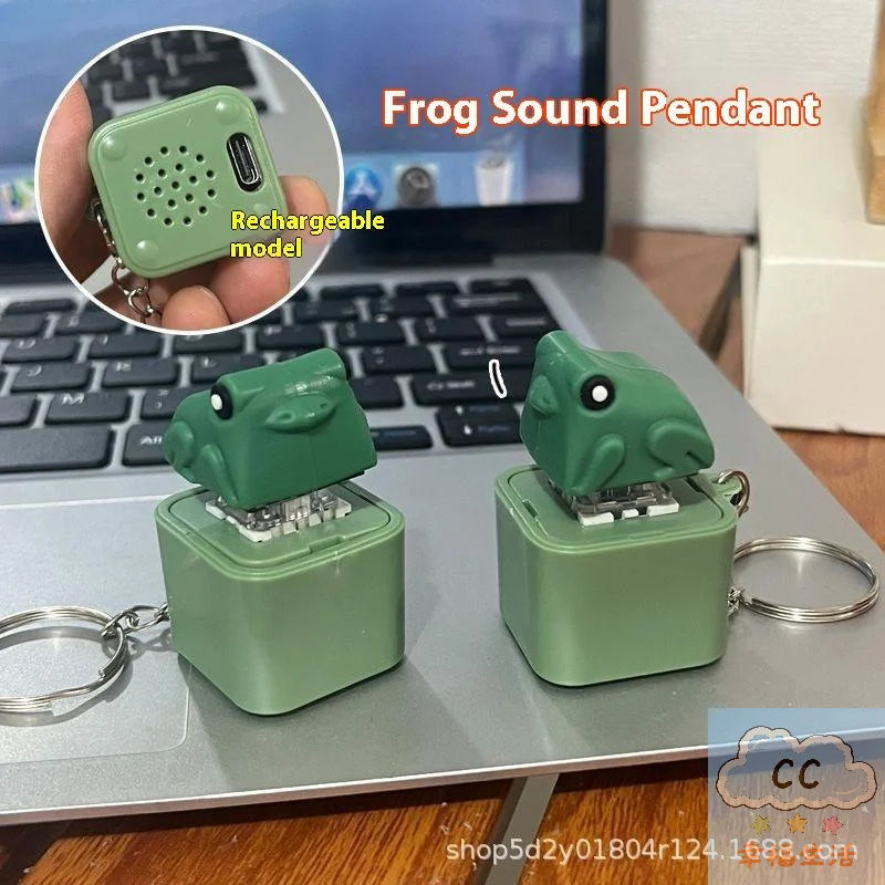 A green frog sound pendant keychain is shown next to its rechargeable model and a laptop.