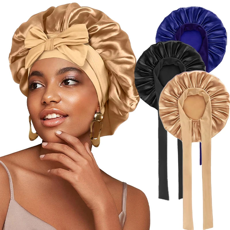 A woman models a satin sleeping bonnet with an adjustable tie in beige, alongside dark and blue satin bonnets.