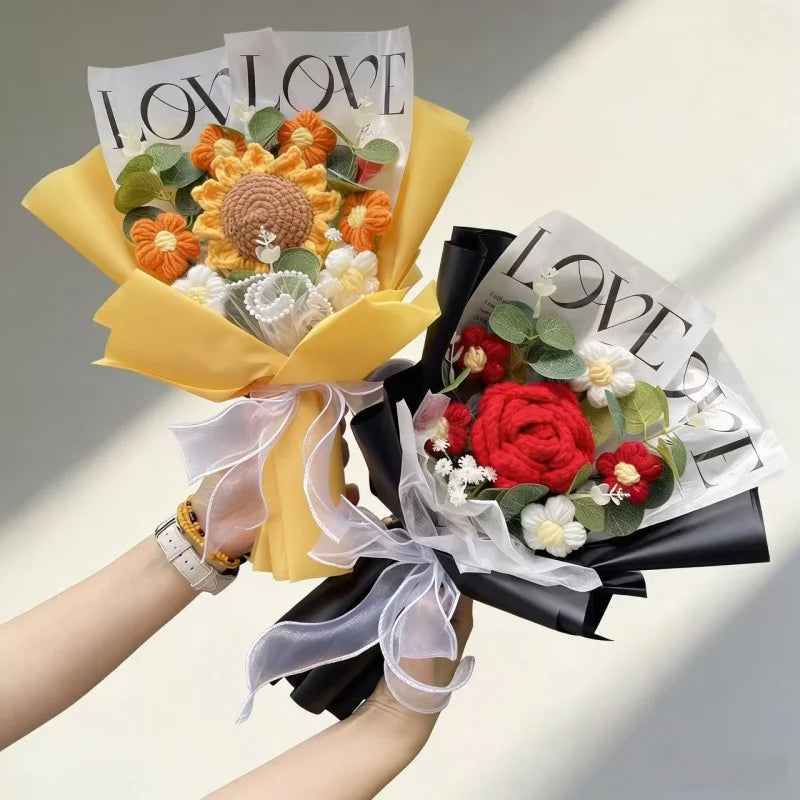 A bouquet of handmade crochet artificial flowers in orange and white, wrapped in yellow paper and black ribbon.