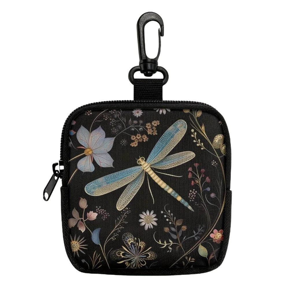 Black mini coin purse with a floral and butterfly print featuring soft blue and beige tones.