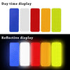 A display showing day time colors and reflective display colors for car safety strips.