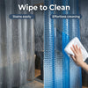 A close-up of a blue crystal texture shower curtain liner being cleaned with a white cloth.