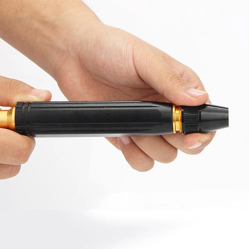 A hand holds a black and gold adjustable high-pressure car wash water gun.