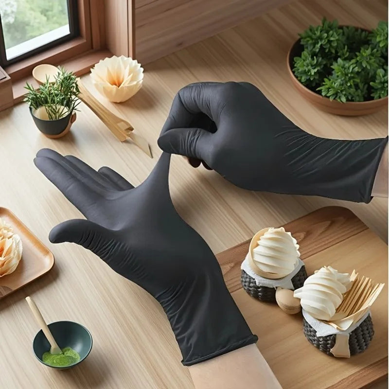 A hand wearing a black disposable nitrile glove is shown interacting with fresh herbs and food items on a wooden table.