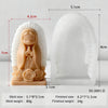 A silicone mold of a praying girl figure in a light peach color, shown next to its finished size.