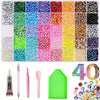 A collection of colorful flatback resin gems and various tools for DIY resin work.