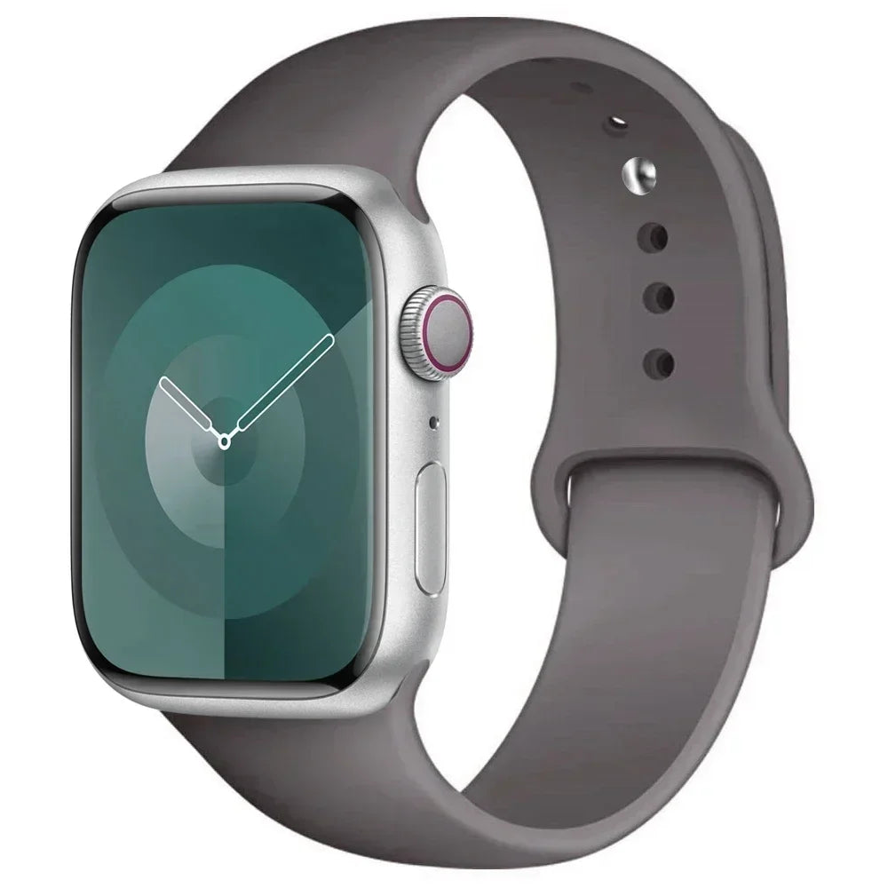 A silver Apple Watch encased in a gray silicone sport band.