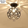 A black crystal single-head ceiling lamp with a metal frame, featuring multiple clear glass bulbs.