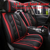 A set of red and black seat covers for a car, showing the interior of a vehicle.