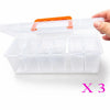 A hand holds a clear plastic multi-compartment hardware storage box with an orange lid, showing three compartments.