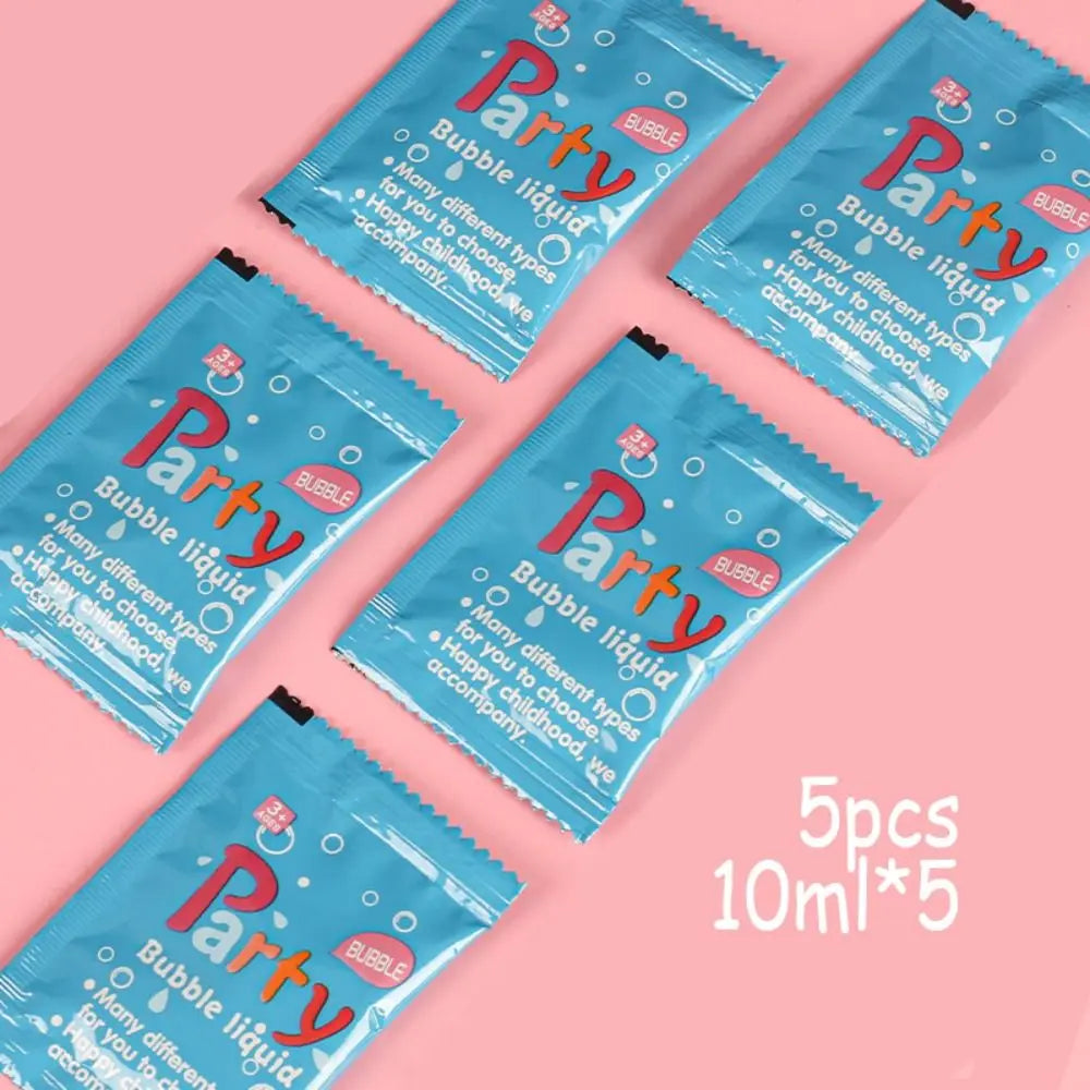 Five blue packets of Party bubble liquid solution, 10ml each, arranged on a pink background.