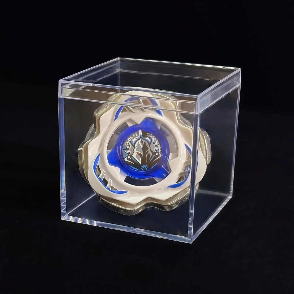 A Valkyrie Volt S4-70V metal spinning top with launcher displayed inside a clear plastic box.