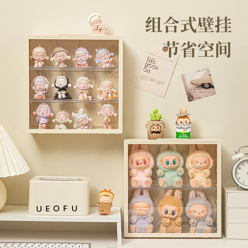 A wall-mounted display case featuring various collectible dolls arranged in tiered compartments.