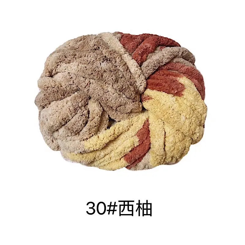 A ball of chunky acrylic yarn featuring a blend of beige, brown, and reddish-brown colors.
