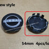 A set of four black wheel center hub caps for Nissan models shown in a red box.