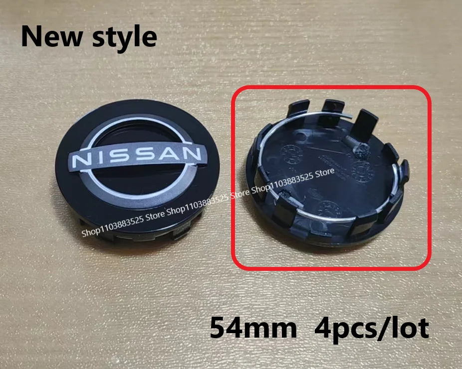 A set of four black wheel center hub caps for Nissan models shown in a red box.