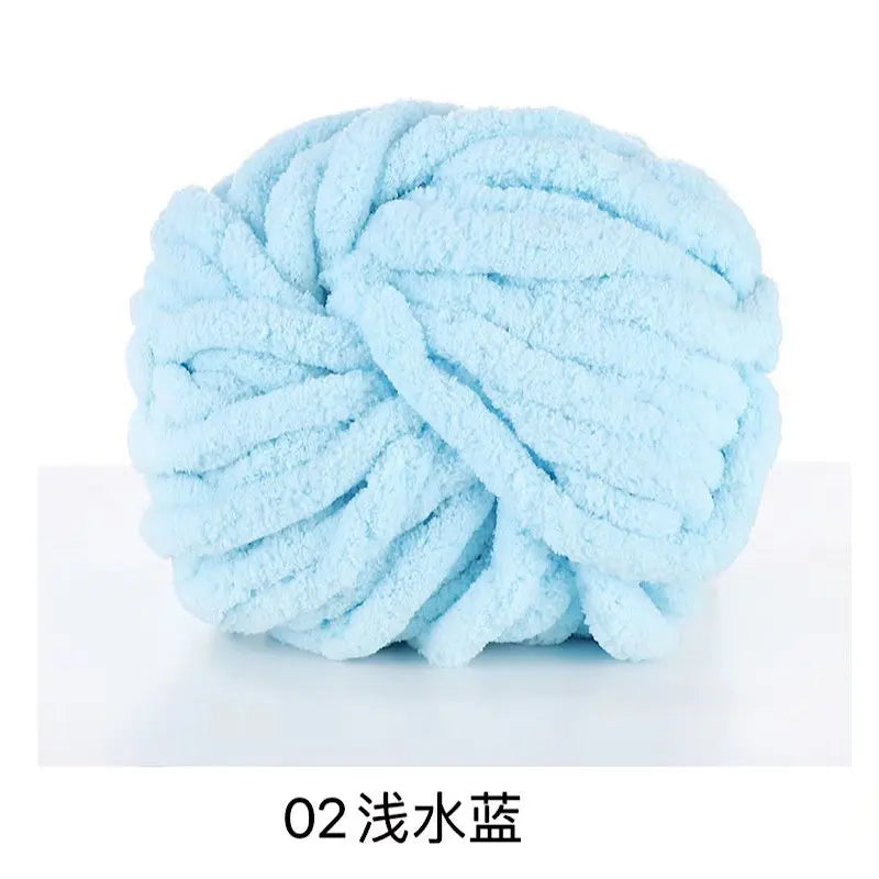 A ball of light blue chunky acrylic yarn for knitting and crochet