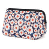 A navy blue and white floral patterned waterproof neoprene cosmetic bag with a black zipper.