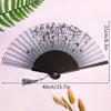 A vintage lace folding hand fan with a black handle and sheer gray paper, displayed on a white background.