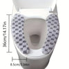A white toilet seat with a gray and white checkered plush cushion cover installed.