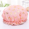 Pink reusable elastic shower cap decorated with gold butterfly patterns