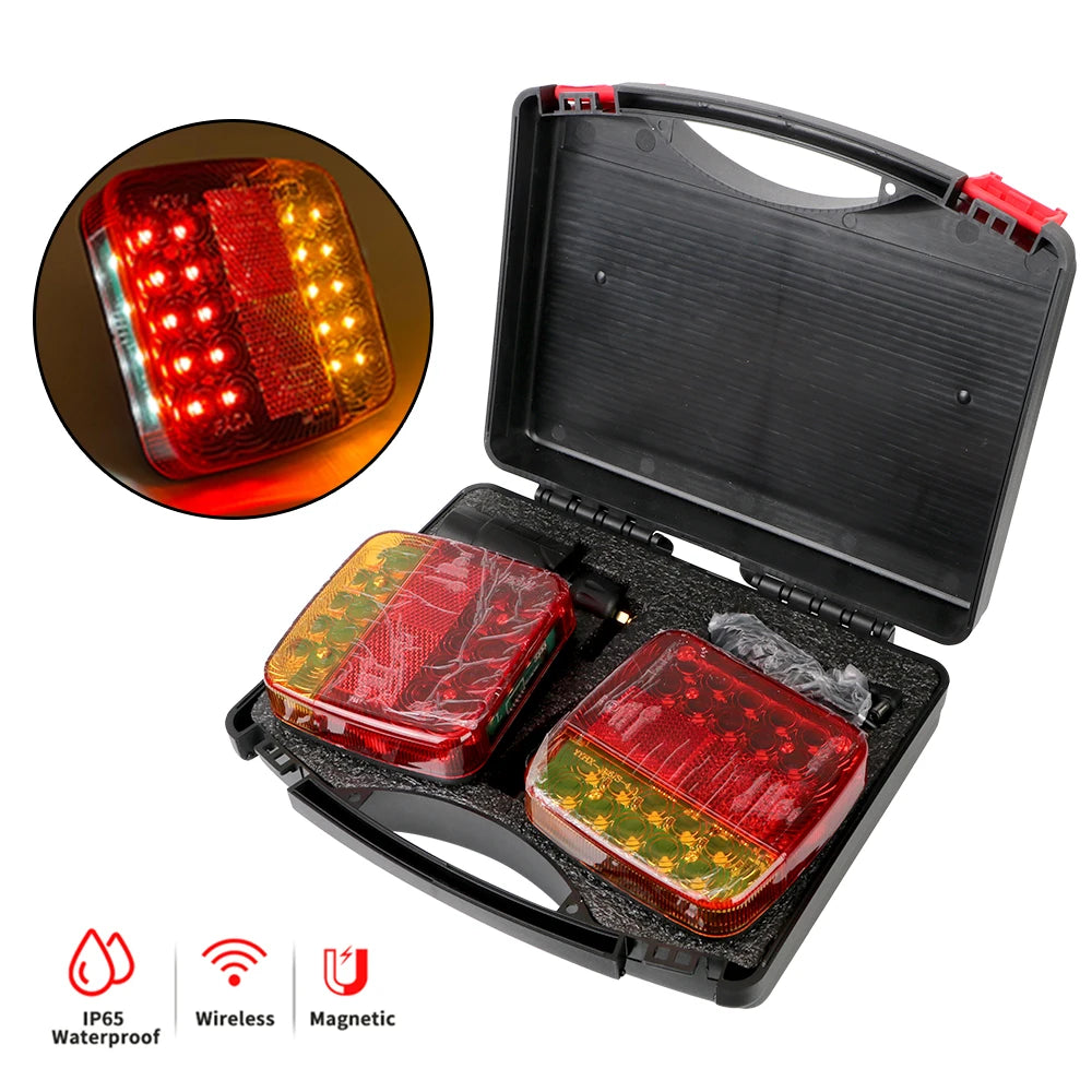A black storage case containing a red LED trailer tail light and a remote control, showing the light's illumination.