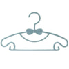 Light blue plastic hanger with a bow design for clothes