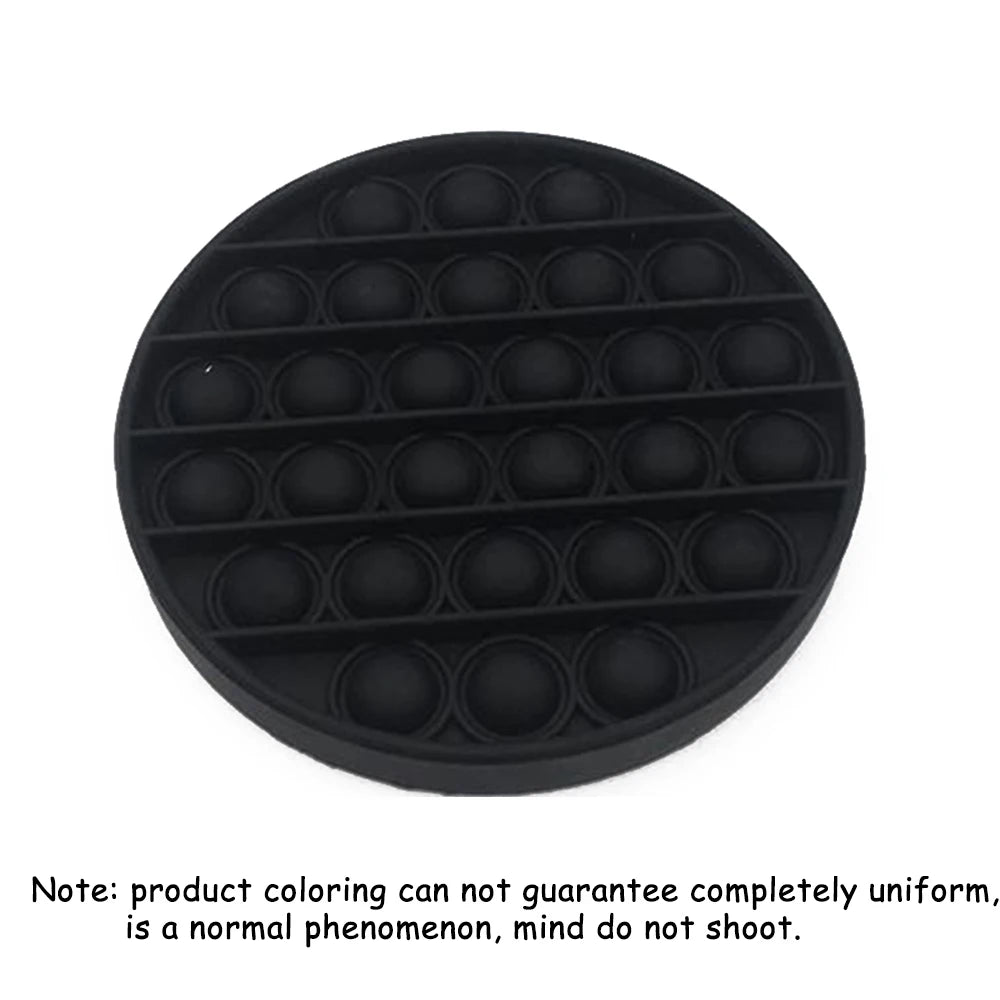 Black silicone Rainbow Pop-It fidget board with multiple small holes for sensory stress relief