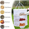 A folding hanging drying net with mesh protection displaying various dried foods like buds, flowers, herbs, fruit, and fish.
