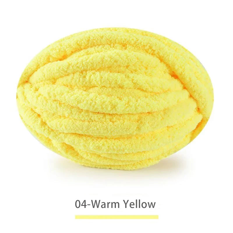 A ball of extra thick chenille yarn in the color warm yellow
