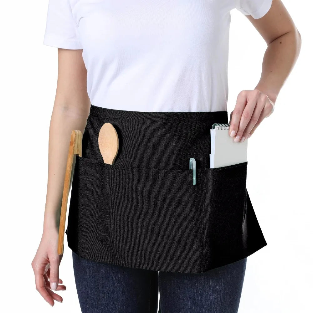 Classic black waist apron with three pockets worn by a person.