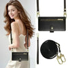 Black leather crossbody phone wallet with zipper closure and card slots worn by a woman.