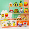 A collection of cute food-themed figurines made from micro building blocks arranged on a wooden shelf.