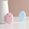 Two round, light pink and blue electronic soap dispensers sit on a white surface next to a white container.