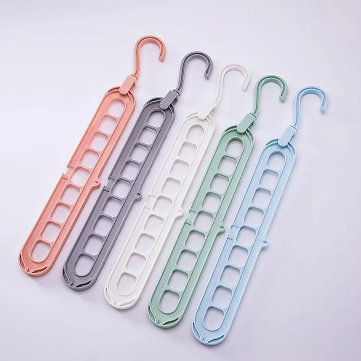 Rotating 9-Hole Folding Clothes Hanger Organizer for Space-Saving Wardrobes