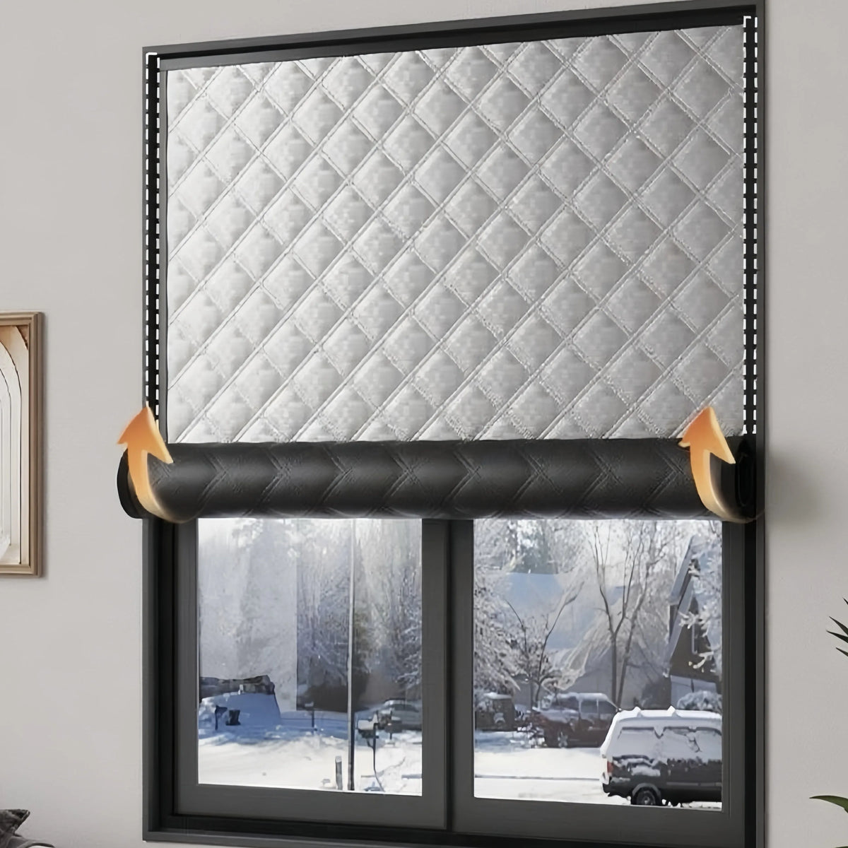 Self-adhesive thermal window film applied to a window, featuring a diamond-patterned silver texture for winter insulation.